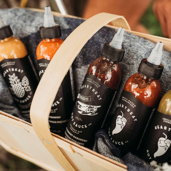 Sauce bottles inside a picnic basket